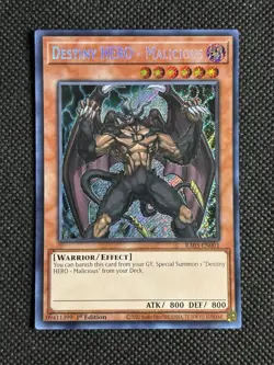 YuGiOh! Destiny HERO - Malicious RA03-EN001 Secret Rare 1st Edition Near Mint - Image 1