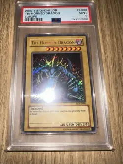 YUGIOH! LOB-E000 TRI-HORNED DRAGON SECRET RARE HOLO FOIL PSA 9 - Image 1