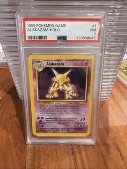 1999 POKEMON GAME #1 ALAKAZAM-HOLO PSA 7 - Image 1