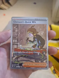 Clemonts Quick Wit 243/191 Pokemon TCG Surging Sparks Special Illustrated Rare - Image 1