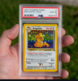 1999 POKEMON FOSSIL #4 DRAGONITE-HOLO PSA 10 - Image 1