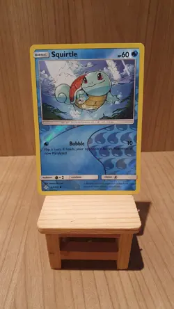 Squirtle 33/214 - Unbroken Bonds - Reverse Holo Pokemon Card - Good Condition - Image 1