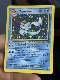 HOLOBLEED Vaporeon 12/64 Jungle 1999 Holo Rare WOTC Pokemon Card TCG - Image 1