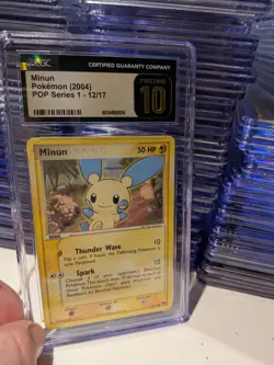 (POP 15) CGC 10 PRISTINE Minun POP Series 1 12/17 2004 Pokemon Card - Image 1