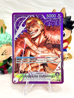 One Piece OP14-060 - Donquixote Doflaming Alt Art LEADER The Azure Sea’s Seven - Image 1