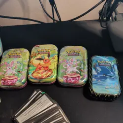 Lot Of Official Pokemon Coins + 71 code cards + keychains & 8 Empty Tins - Image 5