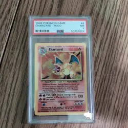 1999 Pokemon Charizard #4 Base Set Holo PSA 7 - Image 1
