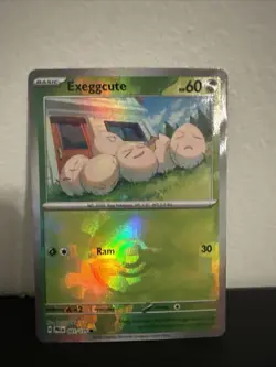 Exeggcute (Poke Ball Pattern) 001/131 Pokemon Prismatic Evolutions Holo - Image 1
