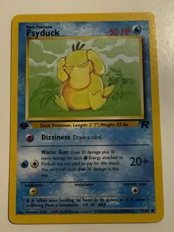 1st Edition Psyduck 65/82 Team Rocket Pokemon Card WOTC 2000 LP - Image 1