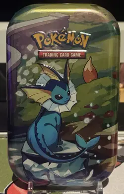 POKEMON TCG PRISMATIC EVOLUTIONS VAPOREON MINI TIN Sealed - Image 1
