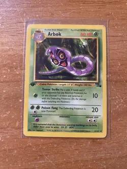1999 Pokemon Fossil 31/62 Arbok 1st Edition LP/MP - Image 1