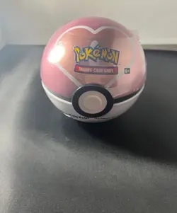 2022 Pokemon Love Pokeball Tin Sealed (damaged) - Image 1