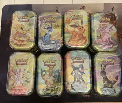 Pokemon TCG Prismatic Evolutions Mini Tin Complete Set - 8 Factory Sealed Tins - Image 1