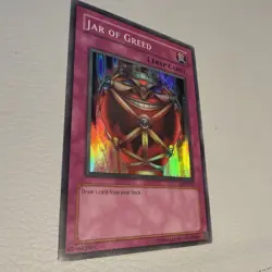 Yu-Gi-Oh Jar of Greed Super Rare Unlimited Edition LON-047 LP - Image 1