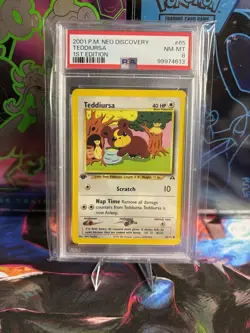 Pokemon Neo Discovery Teddiursa TCG Card #65 First Edition PSA 8 - Image 1