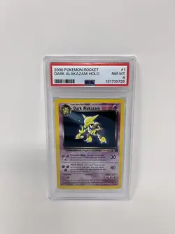 POKEMON 2000 TEAM ROCKET #1 DARK ALAKAZAM HOLO PSA 8 NM-MT - Image 1