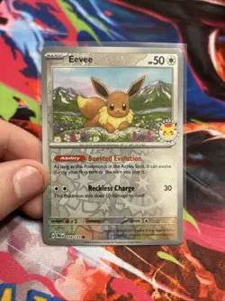 Prismatic Evolutions Eevee 074/131 Cosmo Holo - Pokemon Day Stamped Promo - Image 1