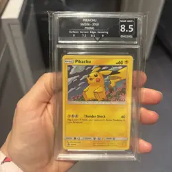 Pokemon Pikachu Unified Minds Black Star Holo Promo SM206 get graded 8.5 - Image 1