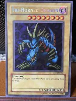Yugioh! TCG Tri-Horned Dragon LOB-EN000 Secret Rare Unlimited - NM - Image 1