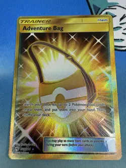 Adventure Bag 228/215 Sun & Moon Lost Thunder Gold Secret Rare 2018 Pokemon Card - Image 1