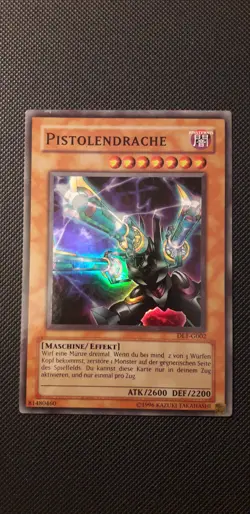 Yu-Gi-Oh! Pistolendrache, DL1-G002, Super Rare, 1. Auflage, Deutsch, NM-EX - Image 1