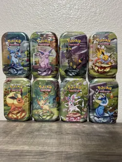 Pokemon Prismatic Evolutions Complete Set of 8 Mini Tins SEALED - Image 1