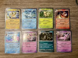 Pokemon Prismatic Evolutions Costco Mini Tin Cosmo Promos 8 Umbreon Sylveon - Image 1