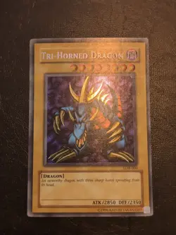 Yu-Gi-OH! SECRET RARE TRI-HORNED DRAGON LOB-000 REVERSE FOIL MISPRINT LP - Image 1
