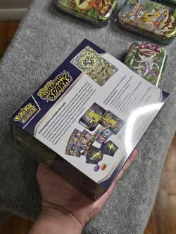 Pokemon Surging Sparks ETB Box & Prismatic Evolution Tin Lot Scarlet & Violet - Image 3