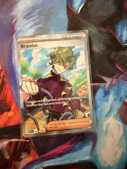 2025 Prismatic Evolutions Brassius 135/131 HOLO Ultra Rare Pokemon Card TCG - Image 1
