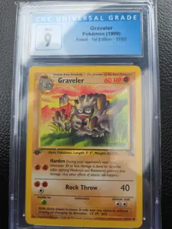 CGC 9 MINT | GRAVELER 37/62 POKEMON (1999) 1ST EDITION FOSSIL - Image 1