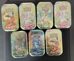 Pokemon TCG Prismatic Evolutions Mini Tins x7 - Sealed - Image 1