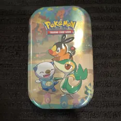 Pokemon TCG 25th Anniversary Tin Featuring Snivy, Tepig, Oshawott Multicolor - Image 1