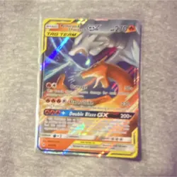 The Pokemon Company Reshiram & Charizard GX TAG TEAM Ultra Rare Full Art SM230 - Image 1