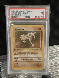 1999 POKEMON FOSSIL 1ST ED #7 HITMONLEE-HOLO PSA 7 - Image 1