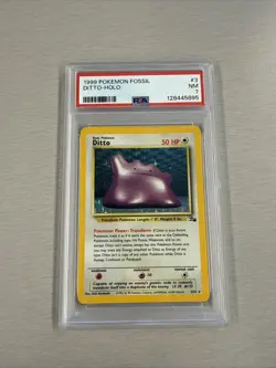 1999 POKEMON FOSSIL #3 DITTO-HOLO PSA 7 - Image 1