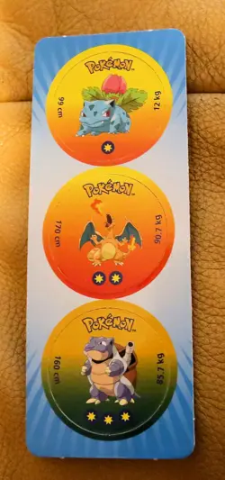 POKEMON 1998 STILL ON CARD COLLECTION OF THREE UNUSED POGS incl #6 CHARIZARD - Image 1