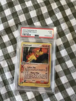 PSA 7 CHARIZARD 100/97 | EX Dragon Holo E Series Graded Pokemon Card 1/2 SWIRL - Image 1