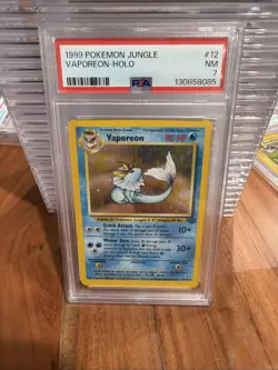 1999 POKEMON JUNGLE #12 VAPOREON-HOLO PSA 7 - Image 1