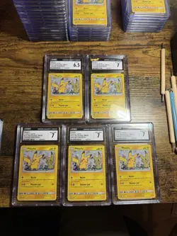 CGC Pokemon TCG Pikachu SM162 Sm Black Star Team Up Promo Holo Lot #1 - Image 1
