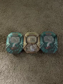 Pokemon TCG Sealed Lot Trading Card Game, 3 Sealed Tins, 2 Sealed Balls. 5 Total - Image 1