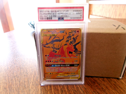 2021 Pokemon SM Black Star Promo Reshiram & Charizard GX #SM247 – PSA 9 MINT - Image 1