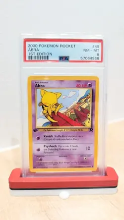 Pokemon TCG Abra Team Rocket 1st Edition PSA 8 - Image 1