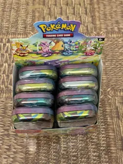 Pokemon TCG Prismatic Evolutions Mini Tins x8 New & Sealed + Display Case - Image 1