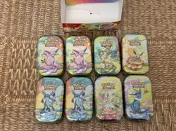 Pokemon TCG Prismatic Evolutions Mini Tins x8 New & Sealed + Display Case - Image 2