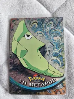 #11 Metapod Holo - 11 TV Animated Series Blue Logo Light Play - Topps Pokemon - Image 1