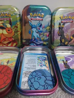 Prismatic Evolutions Tins Full Set Eeveelutions No Packs. Tin, Card, Coin - Image 3