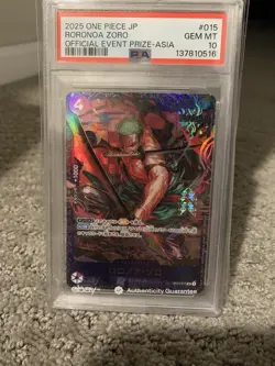 2025 ONE PIECE JPN PROMOS OFFICIAL EVENT PRIZE-ASIA #015 RORONOA ZORO PSA 10 - Image 1