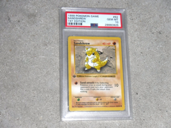 1999 POKEMON GAME SANDSHREW 1ST EDITION CARD #62 POKEMON PSA 10 - Image 1
