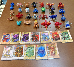 Bakugan Battle Brawlers mixed Lot of 27 Figures with metal cards and case - Image 1